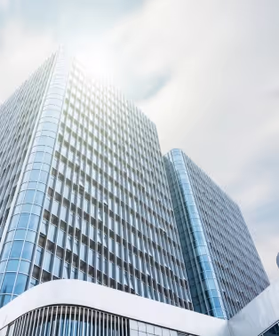 A glass-clad office tower photographed from street level